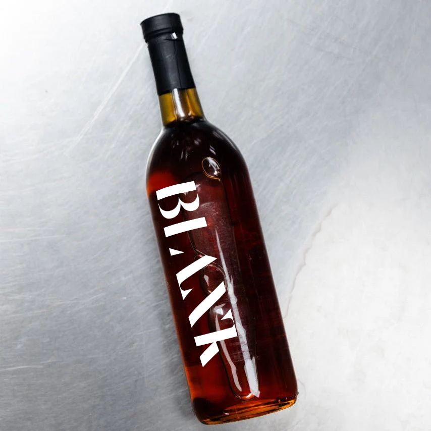 Blank syrup bottle on brushed steel